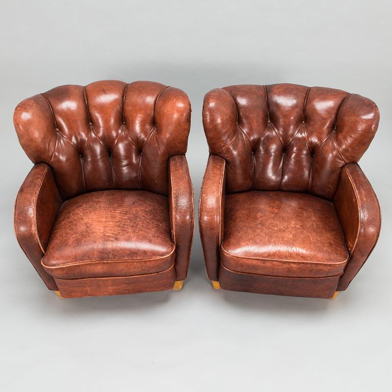 A pair of mid-20th century armchairs.