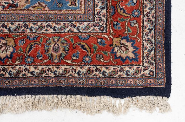 A Mashad carpet, signed, c. 289 x 198 cm.