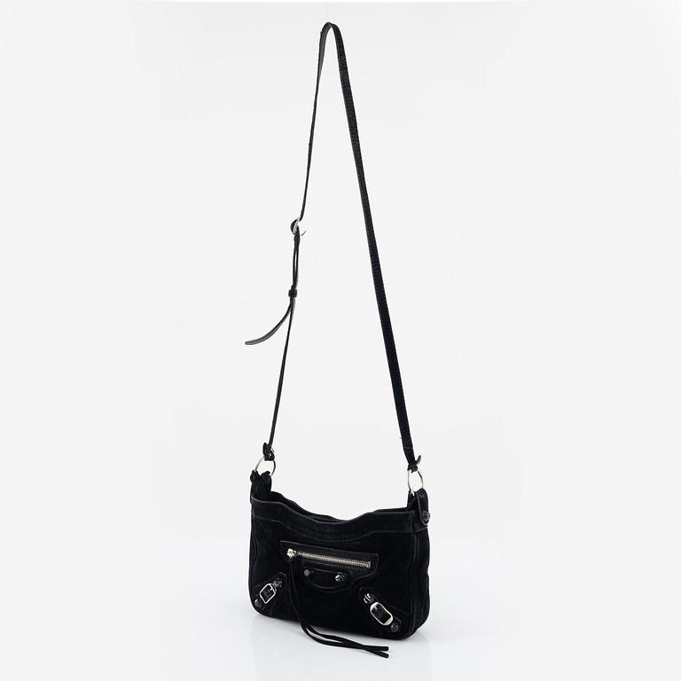 Balenciaga, a black suede 'City' crossbody bag.