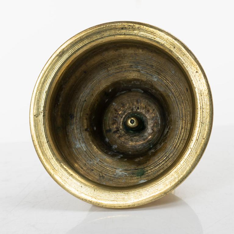 A Northern European baroque brass candlestick, late 17th century.