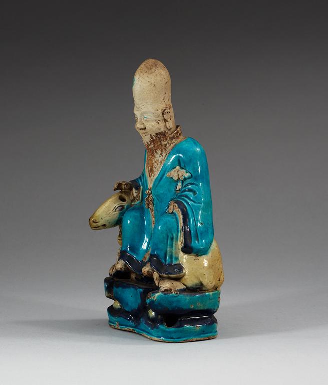 A turquoise-glazed porcelain figure of Shoulao, 17th Century.