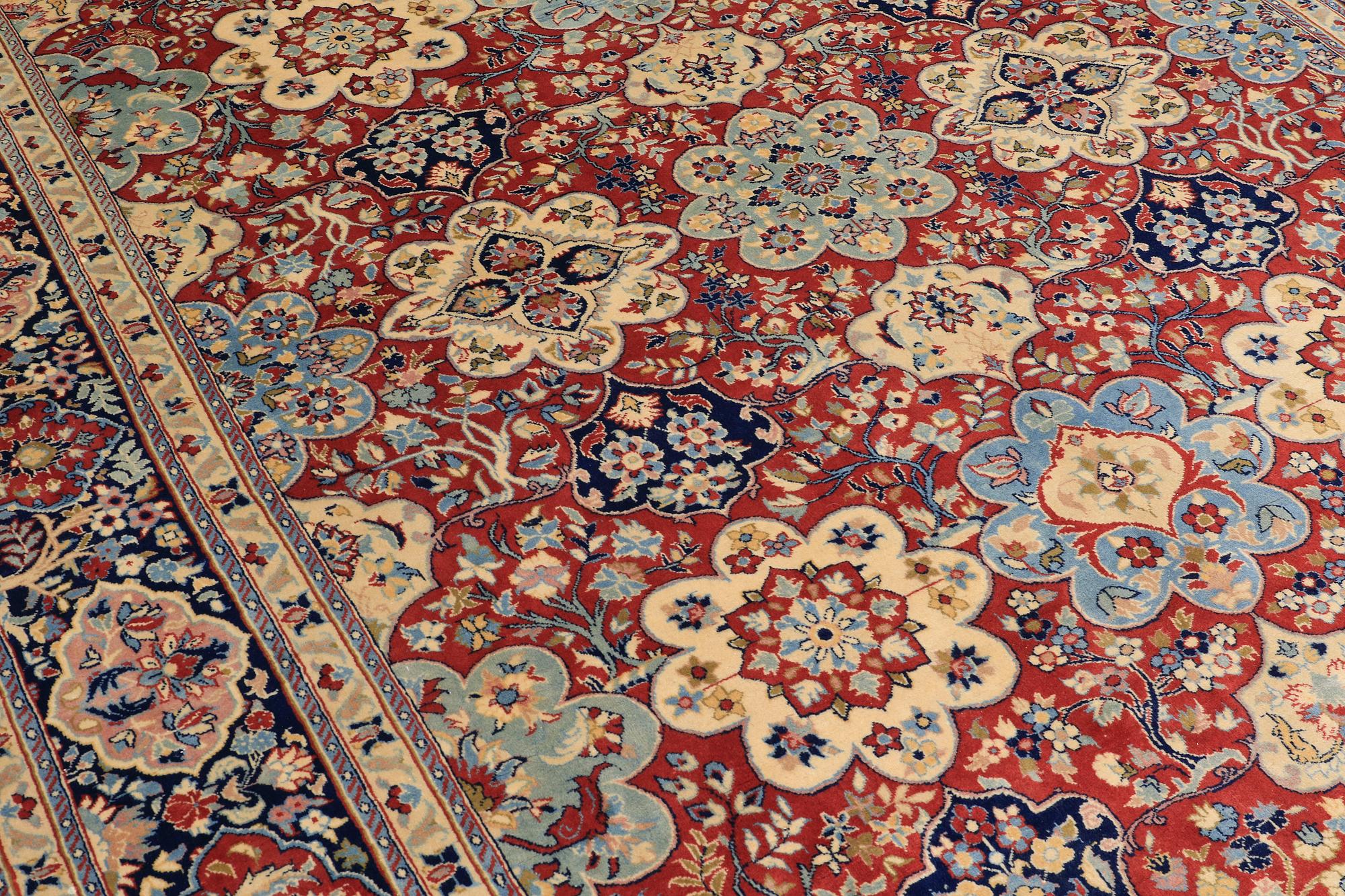 A Sarouk carpet, signed, approx. 327 x 253 cm.