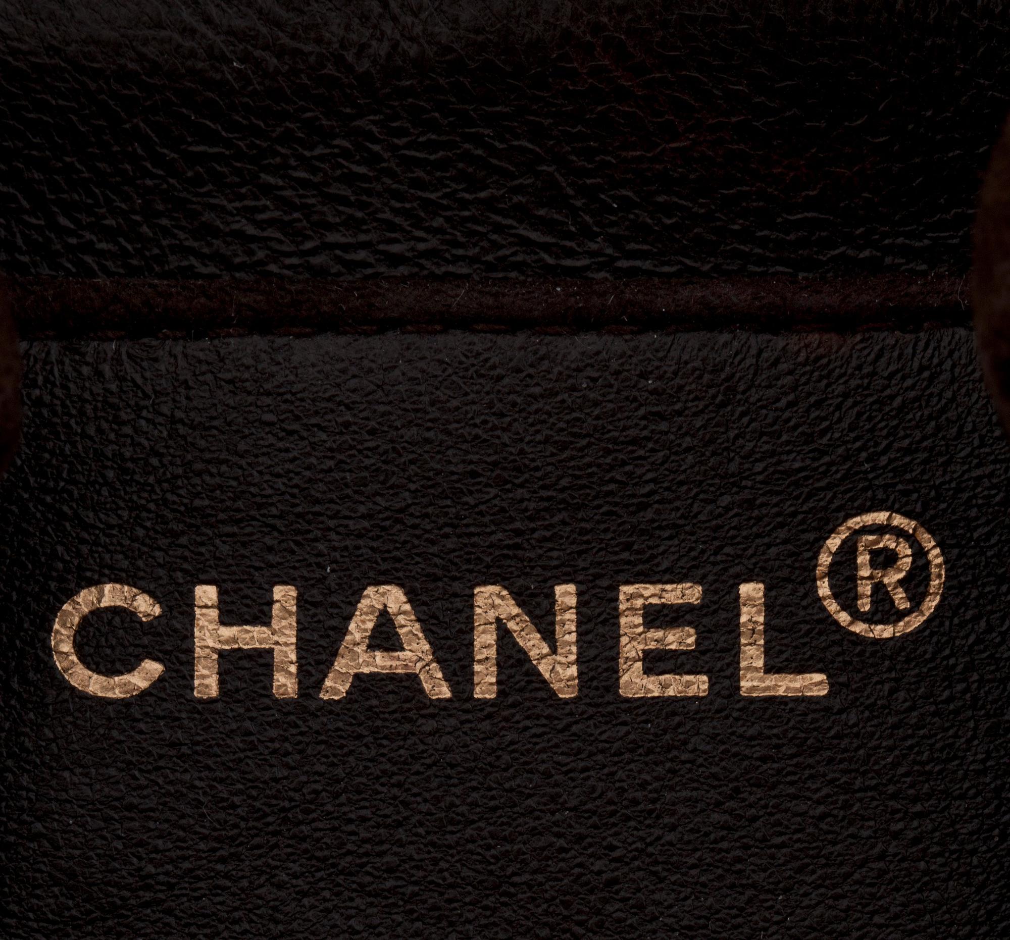 CHANEL, a brown suede shoulderpurse.
