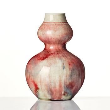 A Chinese peach bloom double gourd vase, Qing dynasty.