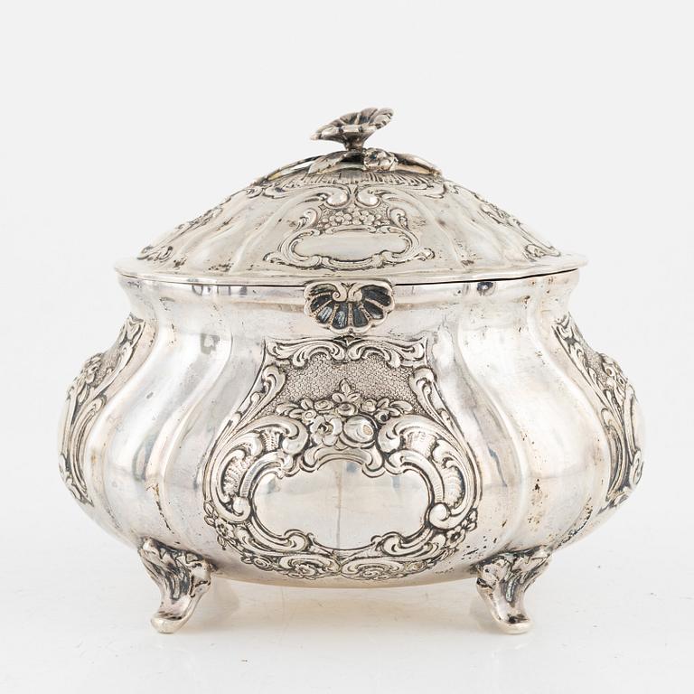 A silver rococo style sugarbox, early 20th Century.