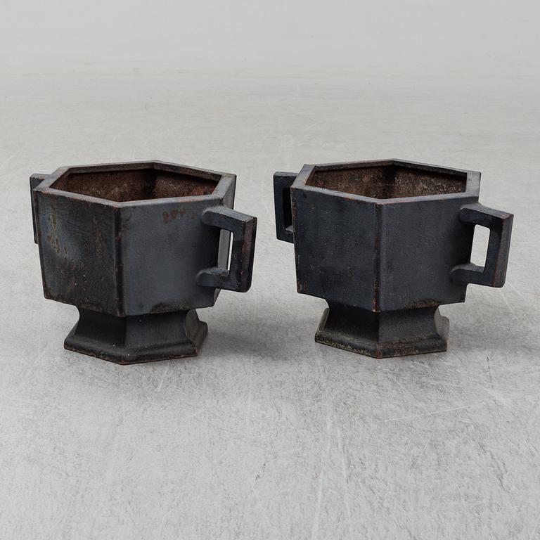 A pair of garden urns, cast iron.