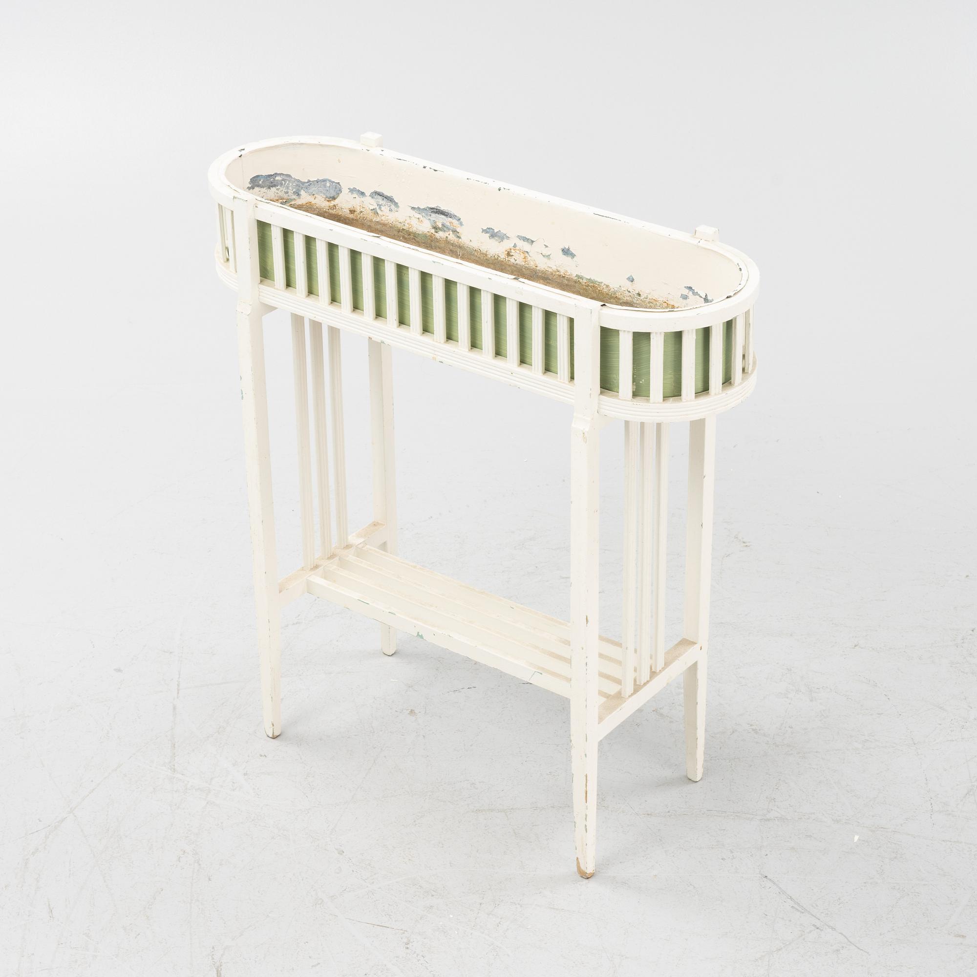 A painted flower stand, early 20th Century.