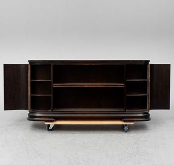 A 1930s stained birch shelf.