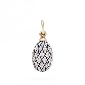 HÄNGE, emaljerat ägg med diamanter totalt ca 0.30 ct. Silver samt 14K guld. Tot ca 4 gram.