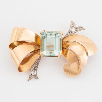 Gold and emerald cut aquamarine brooch.