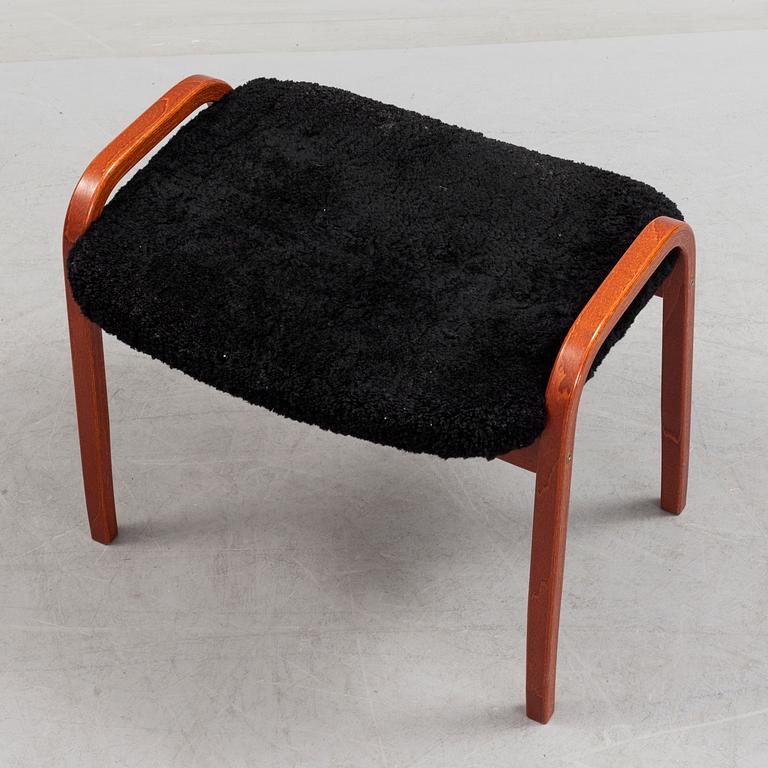 A 'Lamino' foot stool by Yngve Ekström, Swedese.