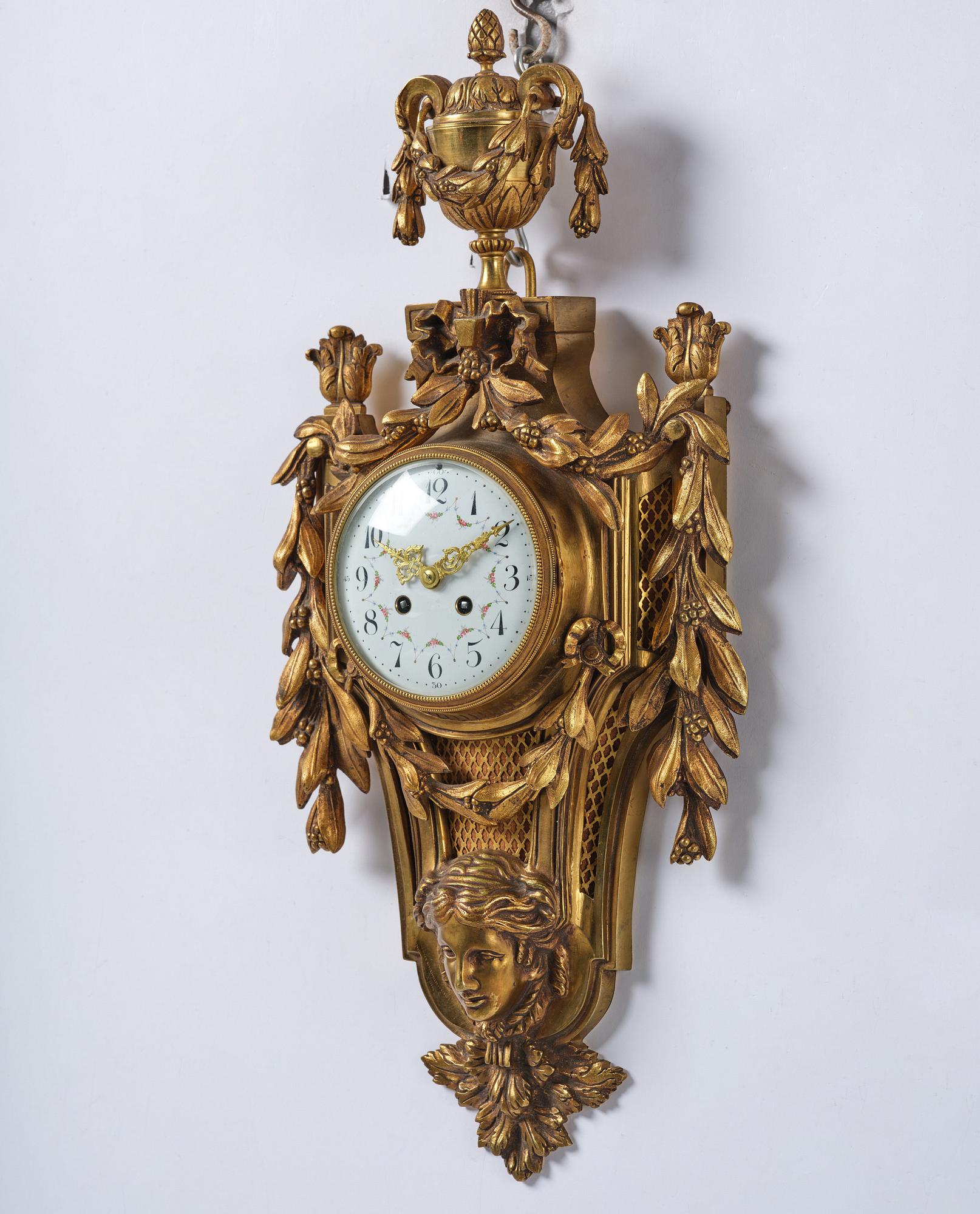 A French  Louis XVI-style wall clock, around 1900.
