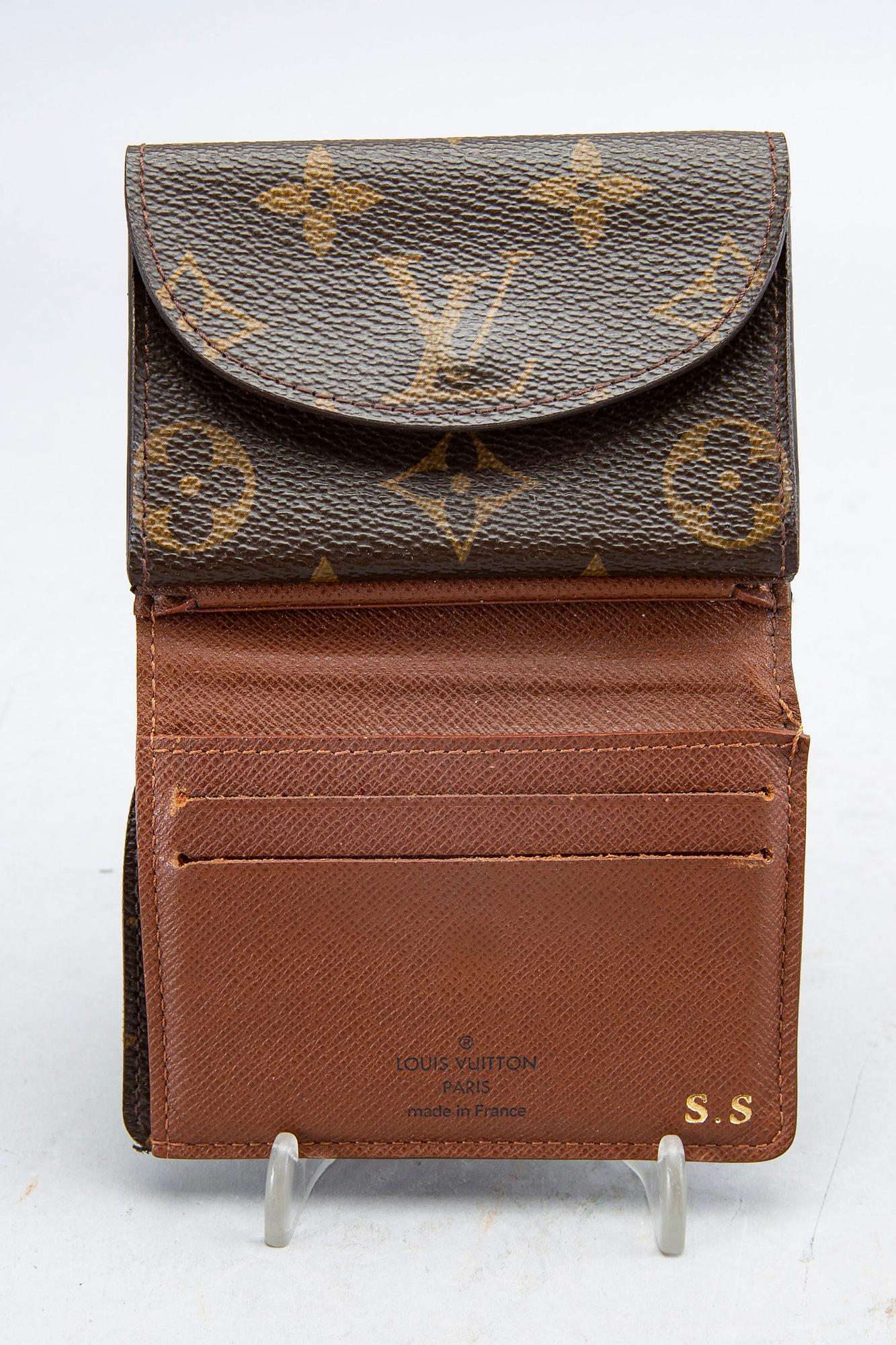 An 'Helene' wallet by Louis Vuitton.