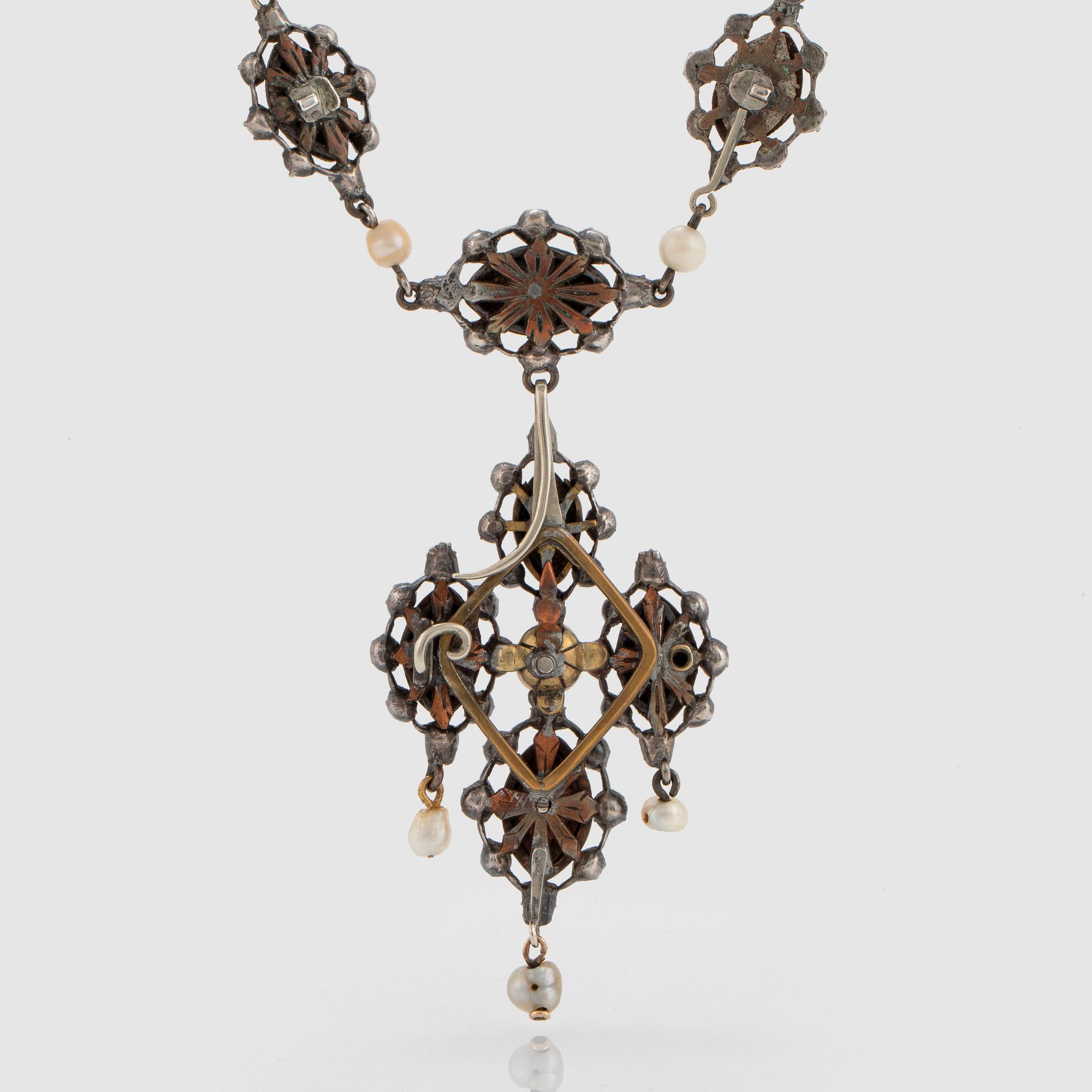 A silver necklace/pendant set with rose-cut diamonds and pearls.