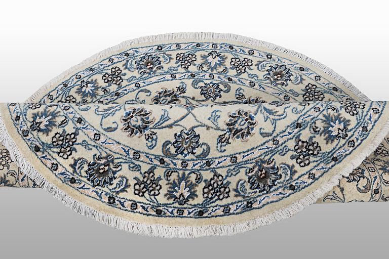 A rug, Nain, part silk, ca 316 x 136 cm.