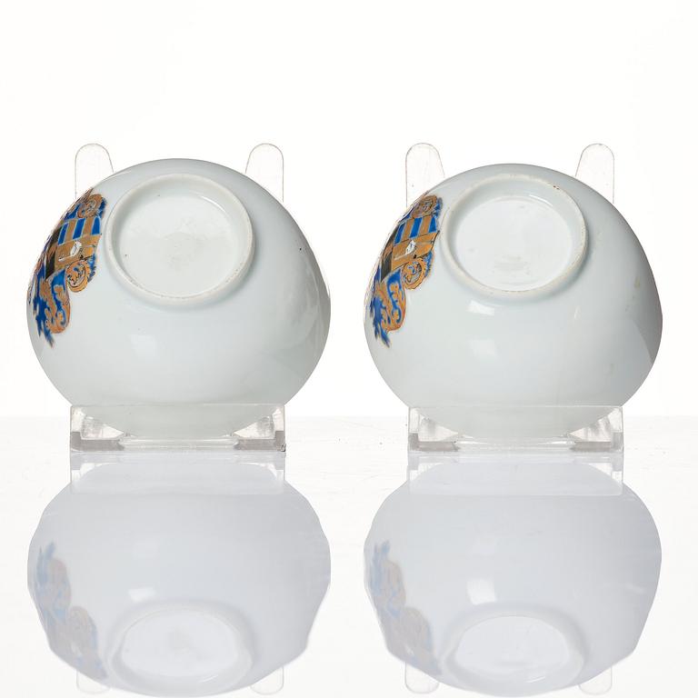 A pair of armorial cups with saucers, Qing dynasty, Qianlong (1736-95).