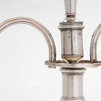 A pair of silver candelabra by Ferdinand Christian Krebs, Breslau, 1776-1792, with snuffers from Reval. Neo-classicism.