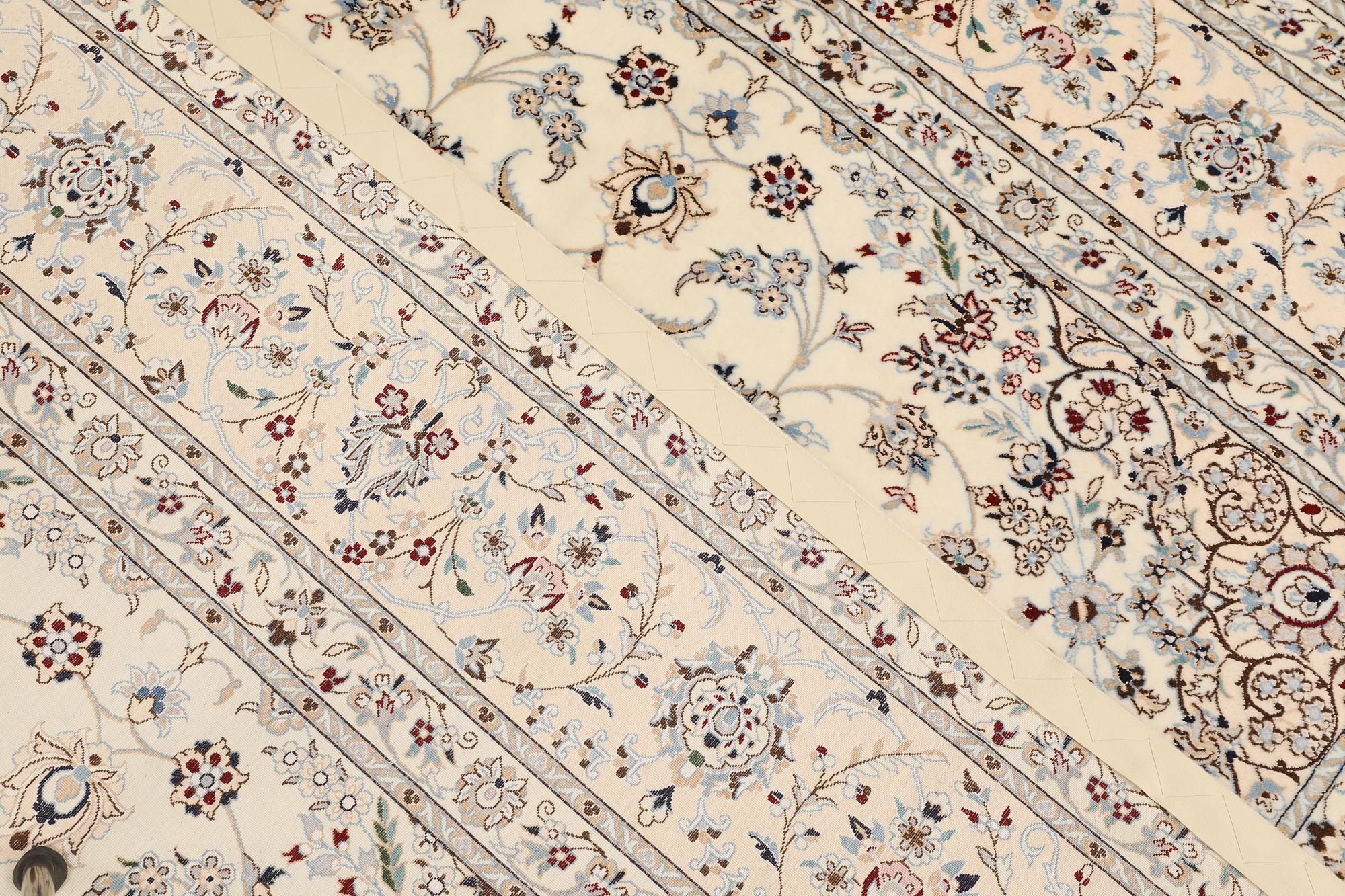 A Nain part silk carpet, c. 207 x 208 cm.