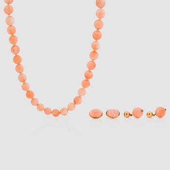 An 'Angel skin' coral necklace. 8.4 - 12.4 mm in diameter and a pair of matching earrings.