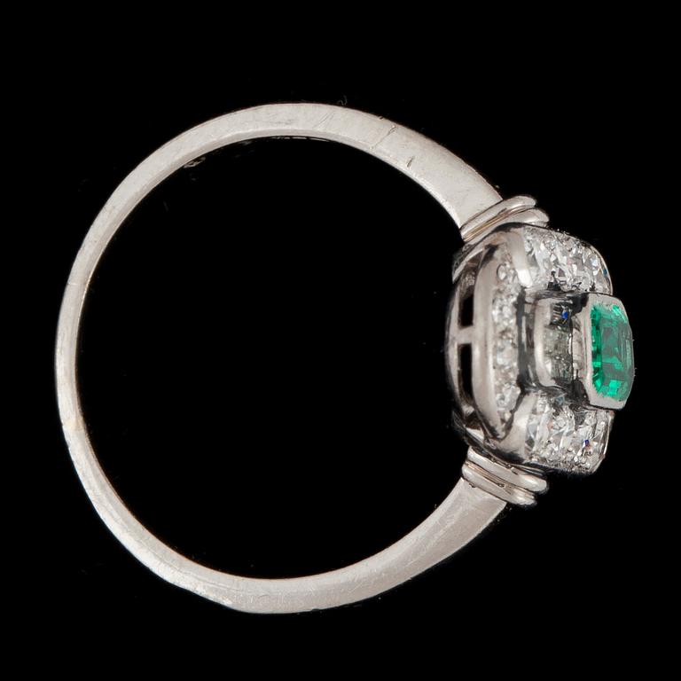 An art déco ring with diamonds and green stone.