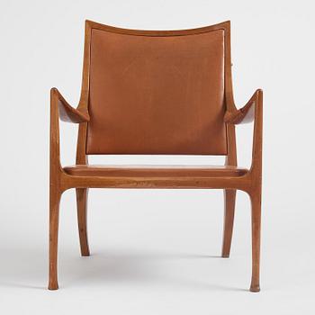 Hans Asplund, a walnut and leather easy chair, Nordiska Kompaniet, ca 1955, for the Nordiska Kompaniet beauty salon.