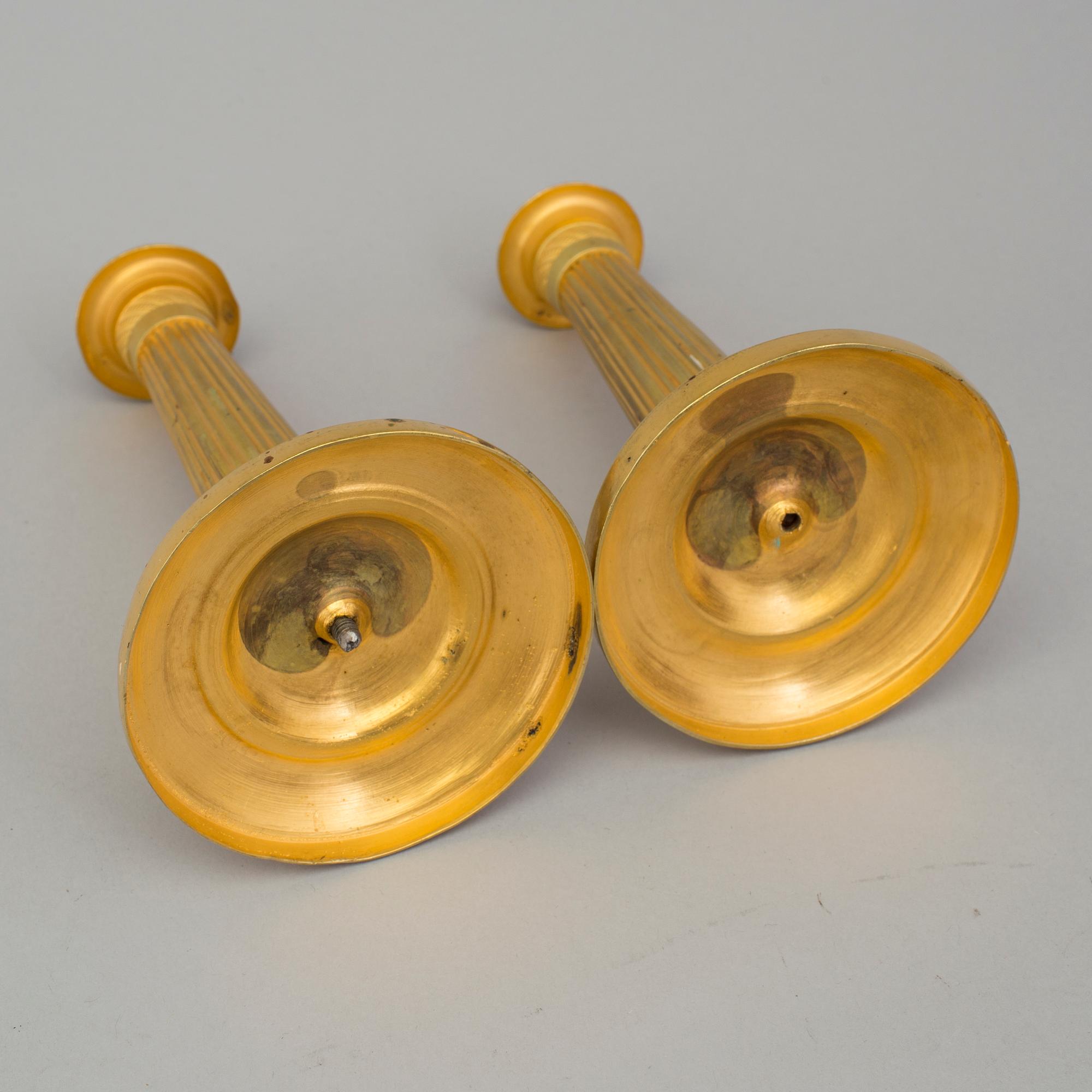 A PAIR OF EMPIRE CANDLESTICKS, first half of the 19th century.
