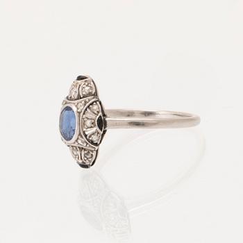 Art Deco platinum ring with an oval faceted sapphire and old-cut and rose-cut diamonds.