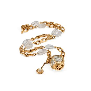 322. YVES SAINT LAURENT, a gold colored necklace with glas stones.