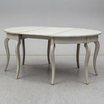 a two-part dining table from the mid 19th century.