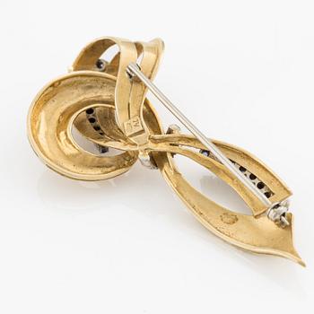 Brooch, 18K gold in the shape of a bow with sapphires, Italy.