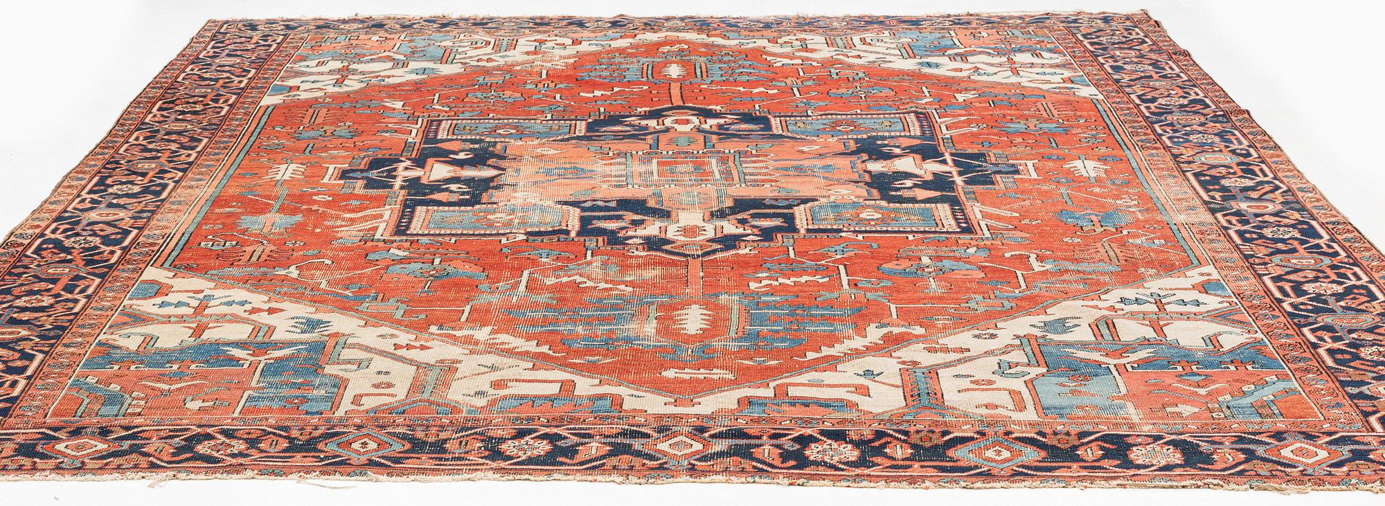 An antique Heriz carpet, ca 350 x 317 cm.