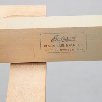 A dining table with six chairs by Carl Malmsten, second half of the 20th Century.