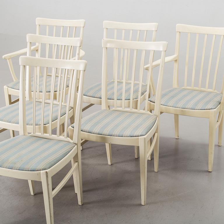 A dining group of 7 pieces by Carl Malmsten for Bodafors from the second half of the 20th century.