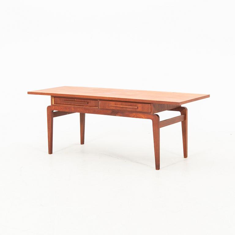 A teak coffee table from the middle of the 20th century.