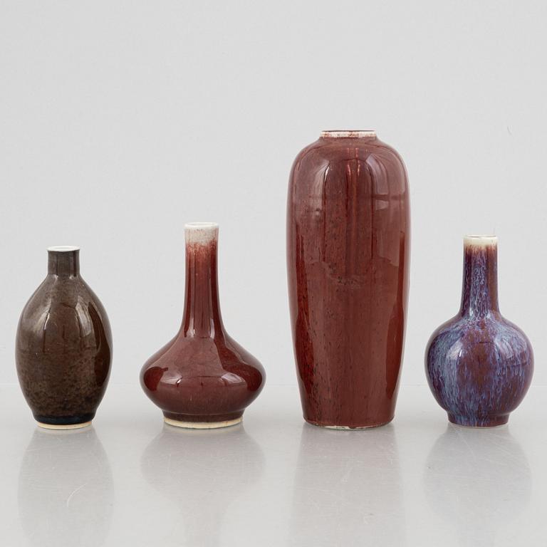 Four oxblood glazed porcelain vases, China, 20th century.