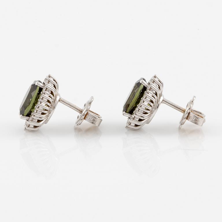 Earrings with green tourmalines and brilliant-cut diamonds.