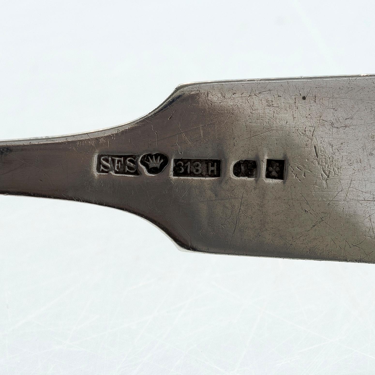 A pair of Russian silver salt cellars, a sprinkle spoon, a sauce ladle, and a tea strainer, Finnish marks.