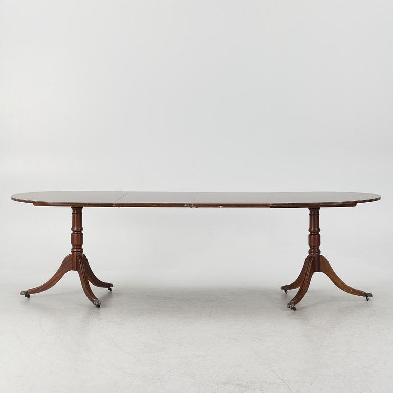 A dining table, 20th century, England.