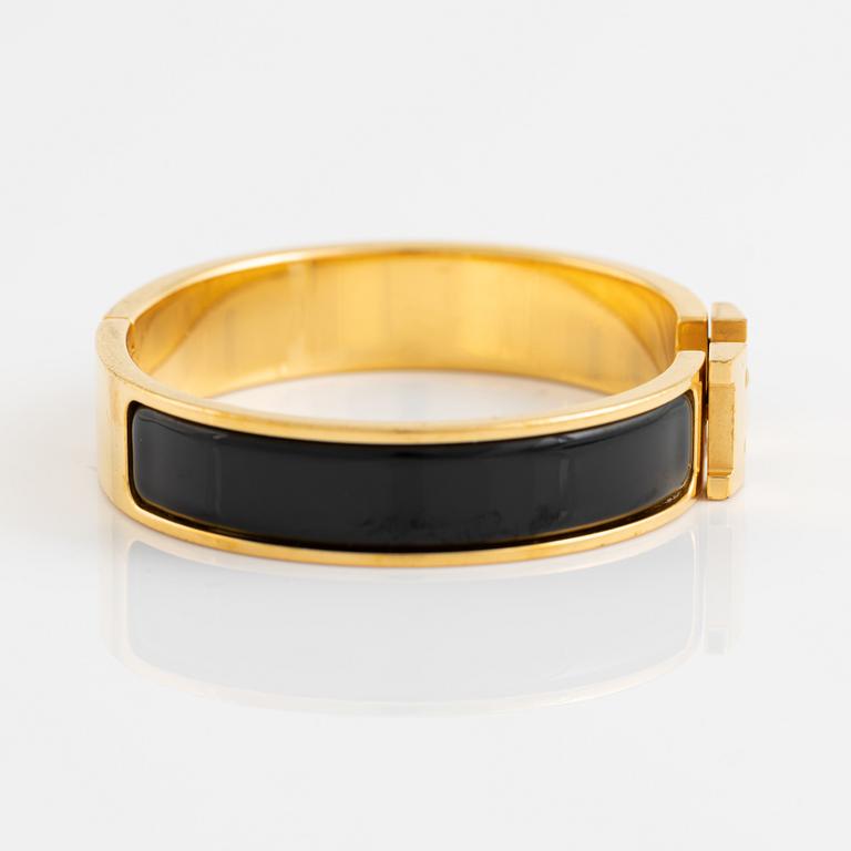 Hermès, a 'Clic H' bracelet.