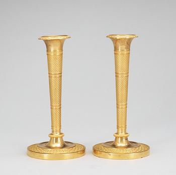 A pair of French Empire early 19th Century candlesticks.