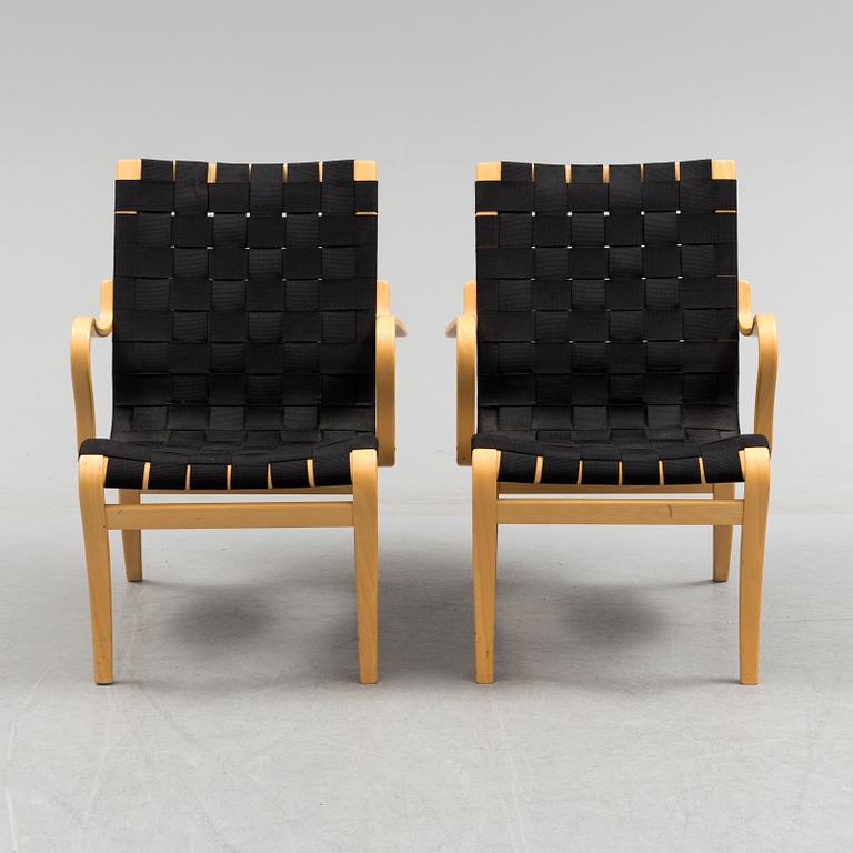 a pair of "Mina" armchairs by Bruno Matsson.