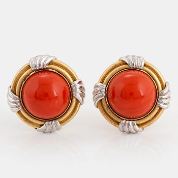 A pair of 18K gold and white gold earrings set with coral.