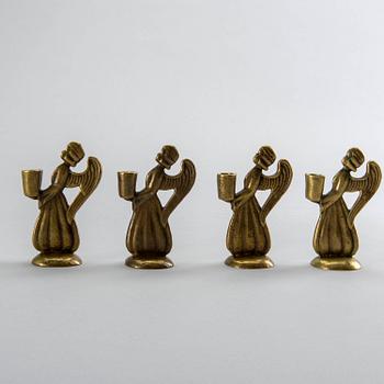 Four second half of the 20th century brass CANDLESTICKS.