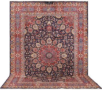 A Kashmar carpet from eastern Iran of 'Ardabil' design, signed, c 338 x 245 cm.