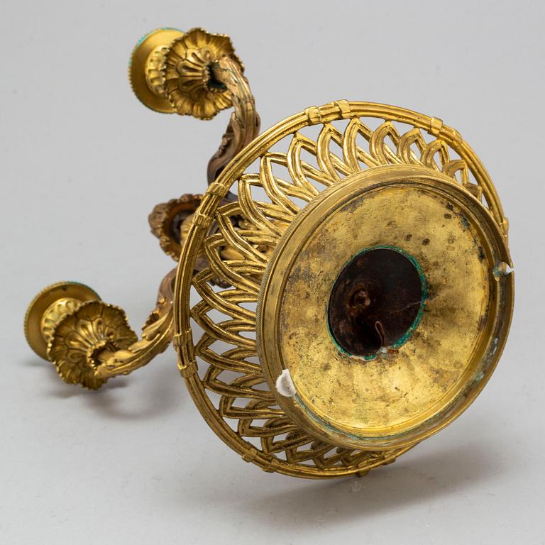 A Louis XVI-style bronze candelabrum, 20th century.