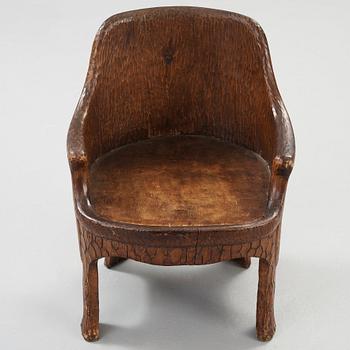 A Gustaf Fjaestad Art Nouveau carved pine chair, 'Stabbestol', by Adolf Swanson, Arvika, Sweden 1908.