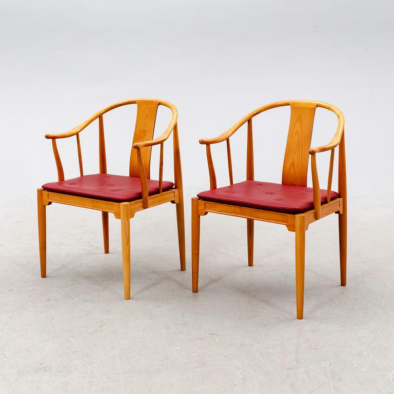 Hans J Wegner, a pair of "China" chairs for Fritz Hansen, Denmark, dated 1994.