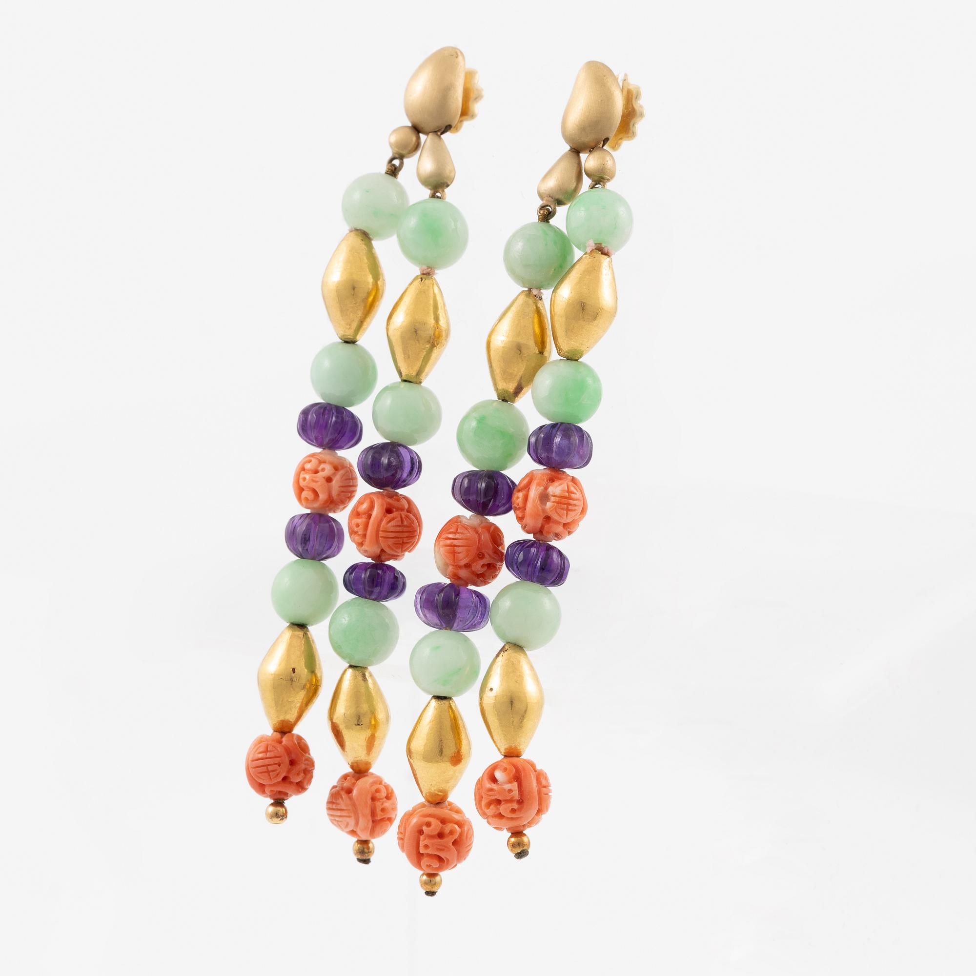 A pair of earrings in 18K gold with various coloured gemstones.