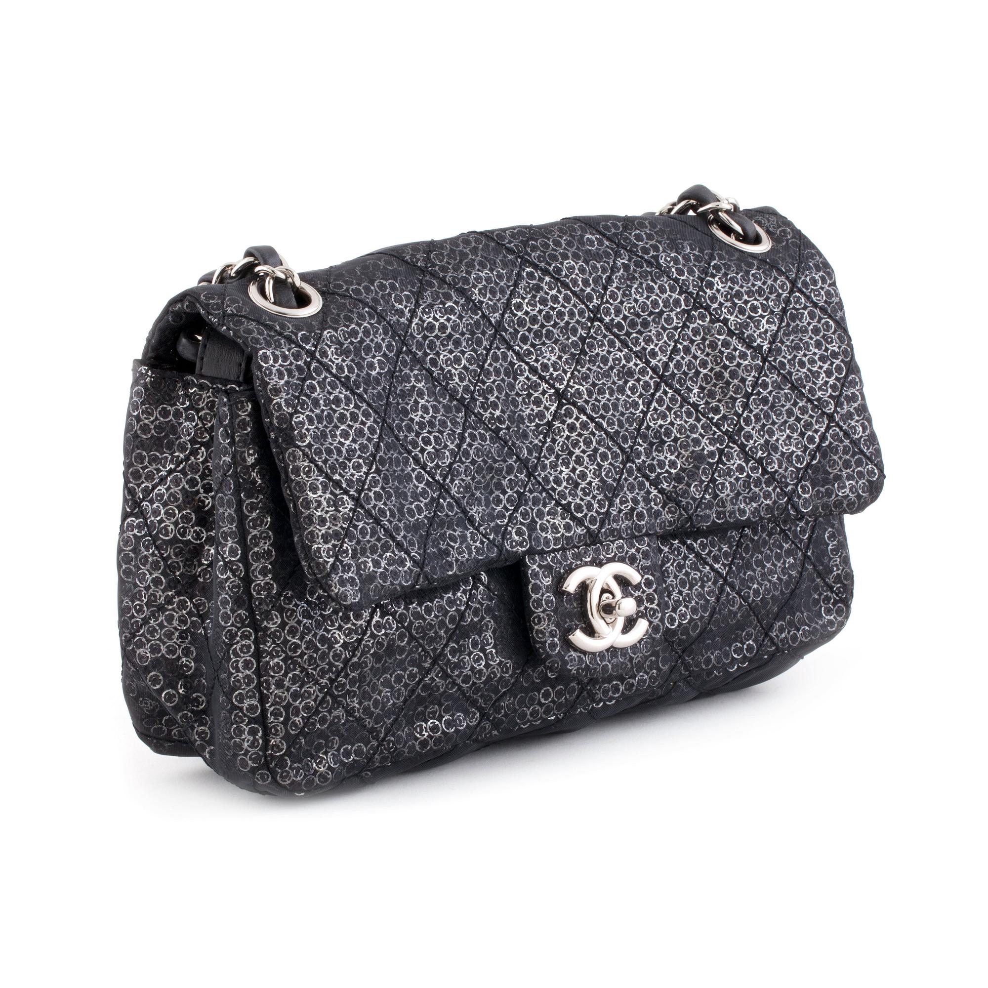 CHANEL, a black and silver tinsel evening "Flap-bag".