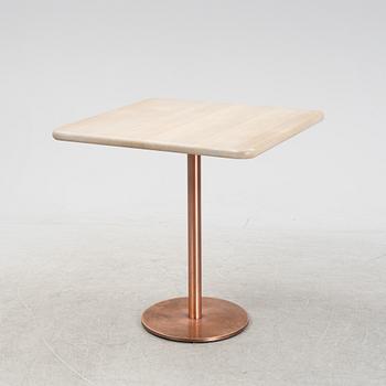 A steel and oak table by Jonas Lindvall 2011.